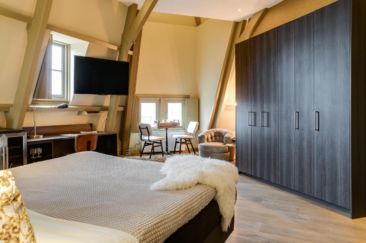 Brasss Hotel Suites Haarlem Eksteriør bilde A bedroom at the hotel