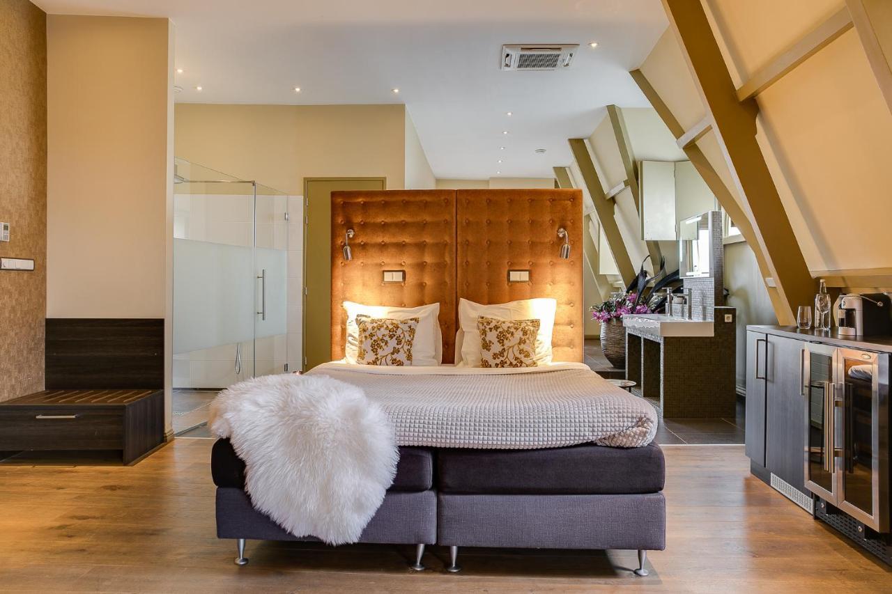 Brasss Hotel Suites Haarlem Eksteriør bilde A bedroom at the hotel
